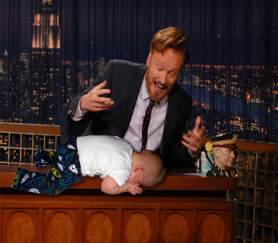 baby planking Conan O'Brien's desk